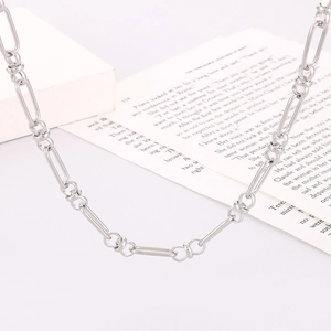 Minimalist stainless steel chain necklace with oval links on a modern white background
