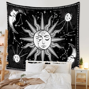 Detail of bohemian sun and moon tapestry with celestial astrology patterns on bedroom wall