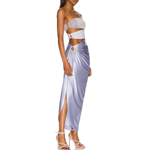 Detail of lavender glitter top and satin maxi skirt with side cutout and metal ring