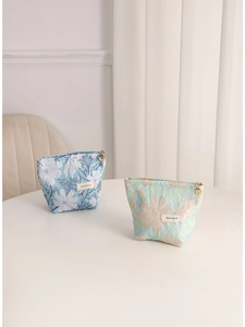 Floral jacquard small makeup bags with gold flower zippers in blue and green fabric