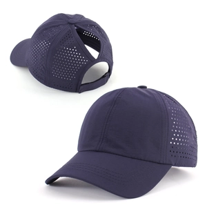 Detail view of navy blue quick-dry baseball cap with laser-cut holes and ponytail opening