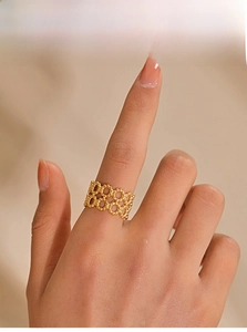 Detailed shot of vintage gold mesh ring featuring milgrain texture and double-layer design