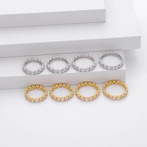 925 Sterling Silver V-shaped eternity rings with gold and silver finishes on white steps