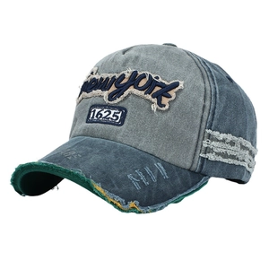 Distressed wash denim baseball cap with New York patch embroidery and ripped detail