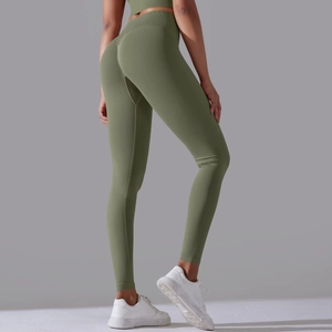 Rear view of olive green high-waisted seamless yoga leggings with push-up effect