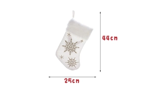 Detailed view of white Christmas stocking with gold snowflake embroidery and size dimensions