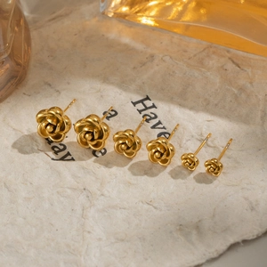 Three pairs of elegant golden rose stud earrings in various sizes with a polished finish