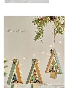 Three wooden Christmas tree ornaments with snowman and reindeer cutouts in a snowy scene