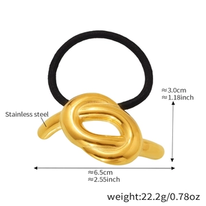 Detailed view of 6.5cm gold twisted metal hair tie made of durable stainless steel