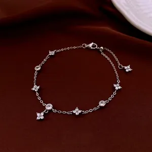 Silver plated four-petal flower zircon bracelet with adjustable chain on red silk