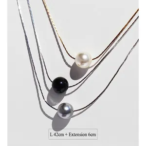 Three-layered pearl and onyx necklace set with gold snake chains and adjustable length