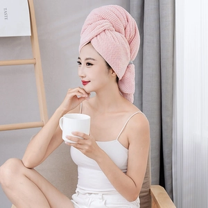 Pink coral fleece hair drying towel with pineapple grid texture and button closure
