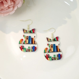 Creative acrylic teacher's day cat earrings featuring colorful book print design
