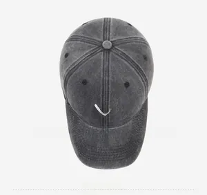 Top view of washed charcoal baseball cap with white heart embroidery detail