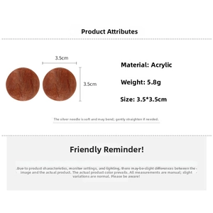 Macro shot of large 3.5cm brown acrylic geometric round stud earrings with silver needles