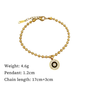 Detailed shot of titanium steel gold bracelet with Roman circle rhinestone pendant