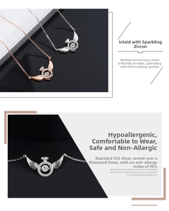 Detailed macro view of 925 sterling silver angel wing pendant with dancing zircon stone