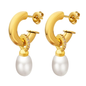 Golden C-shaped hoop earrings with Baroque pearls and sparkling crystals in white background