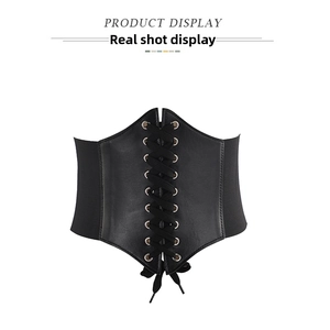 Close-up of vintage black corset belt with lace-up front design and elastic bands