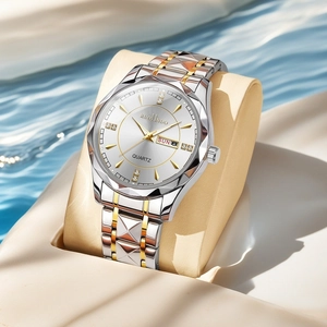 Detail of waterproof quartz watch with dual calendar on textured sand and water backdrop