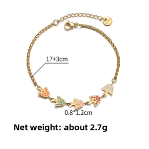Detail of 14K gold plated bracelet featuring five colorful polka dot mushroom pendants