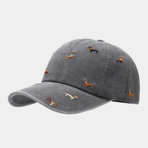 Macro detail of high-quality dachshund dog embroidery on charcoal washed cotton baseball cap
