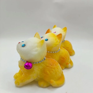 Detailed view of three cute yellow and white gradient kittens with beaded bell collars