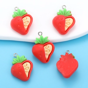 Macro shot of 5 resin strawberry slice charms with metal rings for jewelry making