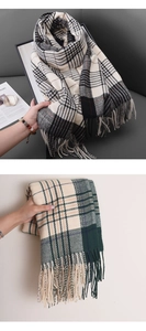 Detail shot of plaid tassel scarf showing cashmere texture and fringe finish in neutral tones
