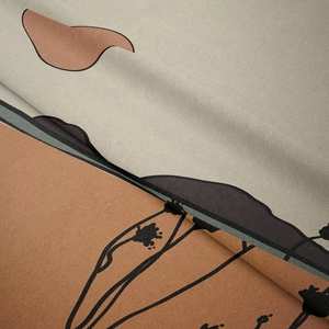 Close-up of bohemian tapestry fabric showing soft velvet texture and abstract Morandi patterns