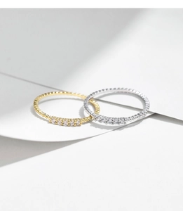 Detail of elegant gold and silver s925 rings with sparkling VVS1 moissanite stones