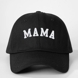Close-up detail of white MAMA embroidery on a black cotton canvas baseball cap