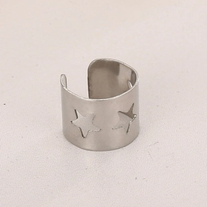 Surgical steel cuff earring featuring minimalist hollow star patterns in silver finish
