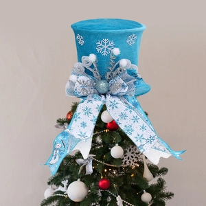 Blue velvet Christmas tree topper hat with silver snowflake patterns and large bow