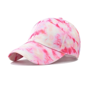 Detailed view of pink and white marble tie-dye pattern on a cotton baseball cap