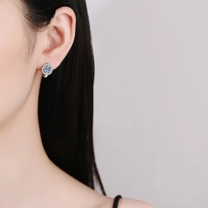 Elegant S925 sterling silver sunflower moissanite earrings on female model