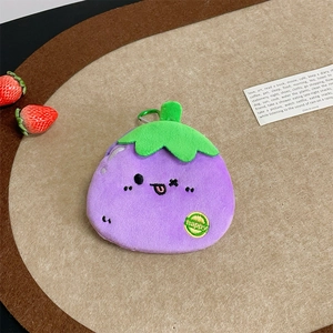 Cute plush eggplant coin purse with happy embroidery and green hook on wooden tray