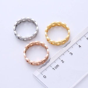 Detailed size measurement of gold, silver, and rose gold chain rings with a clear ruler