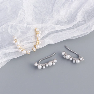 Detailed close-up of s925 silver pearl branch ear clips in gold and silver finishes
