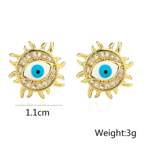 Close-up of gold evil eye earrings with zircon sunburst design measuring 1.1cm in diameter