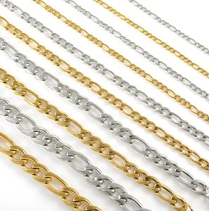 Close-up of Figaro link necklaces in gold and silver steel showing various widths