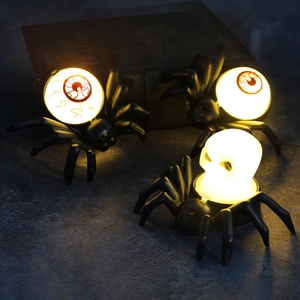 Halloween spider LED candle lights with skull and eyeball designs for spooky atmosphere