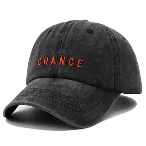Washed dark gray baseball cap with orange CHANCE embroidery and curved brim