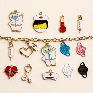 Medical themed enamel charms with doctors, nurse caps and masks on a gold necklace