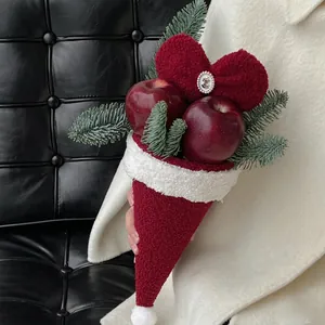Christmas bouquet with red faux apples and plush heart in a lamb wool cone wrap