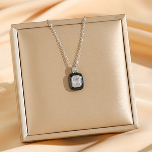 Elegant silver chain necklace with black enamel rectangular pendant and clear zircon stone