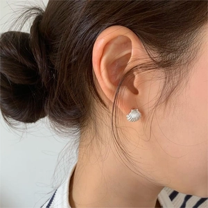 S925 sterling silver shell earrings with textured stripes on ear for daily wear