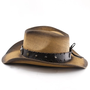 Detail of ombre brown cowboy straw hat featuring leather band with star and silver studs