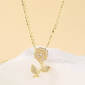 Elegant 18K gold plated rose pendant necklace with zircon and Figaro chain on stone