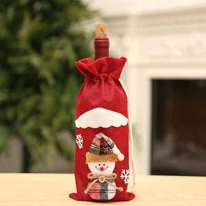 Red linen Christmas wine bottle cover featuring snowman embroidery with snowflake patterns